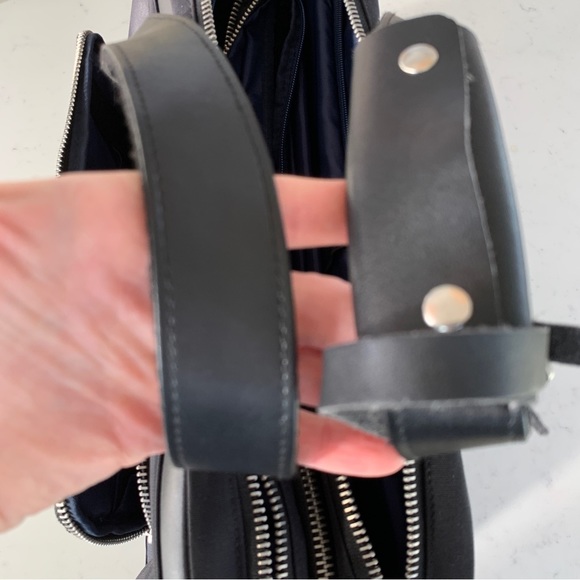 Black Travel Bag with Structured Design and Metal Feet - Picture 13 of 16